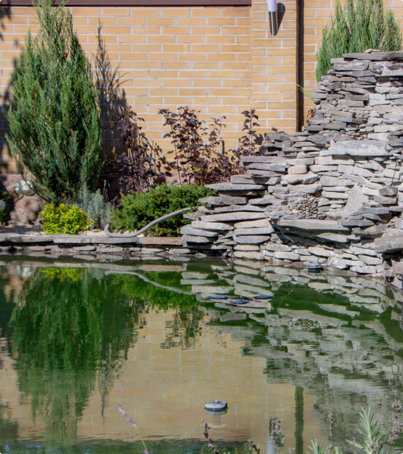Creative and Artistic Rock Creation with a Man Made Rock Pond with Garden