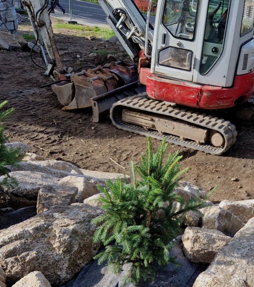 Commercial Excavator Digging Up Ground in Backyard for a Rock Pool